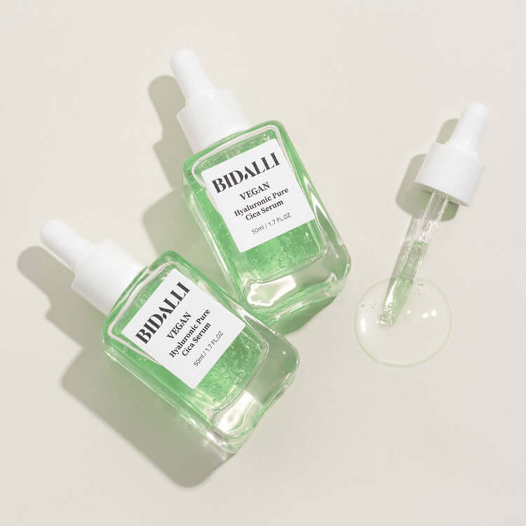 Two bottles of Bidalli Vegan Hyaluronic Pure Cica Serum with dropper showing clear green gel texture
