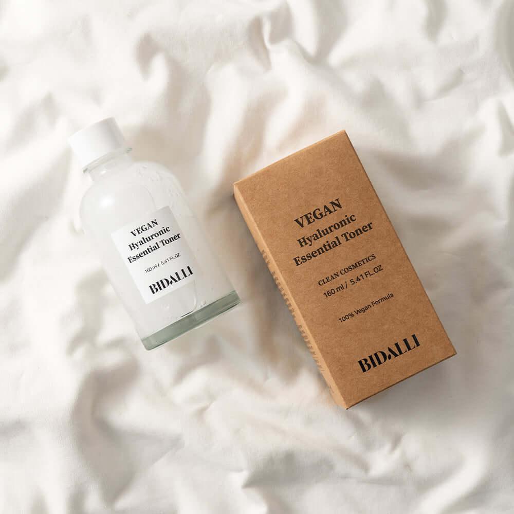 Bidalli Vegan Hyaluronic Essential Toner with kraft box on soft white fabric, deeply hydrating vegan toner for sensitive and dry skin, 160ml